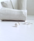 White studs sterling silver earrings, faceted pebbles round