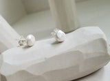 White studs sterling silver earrings, faceted pebbles round